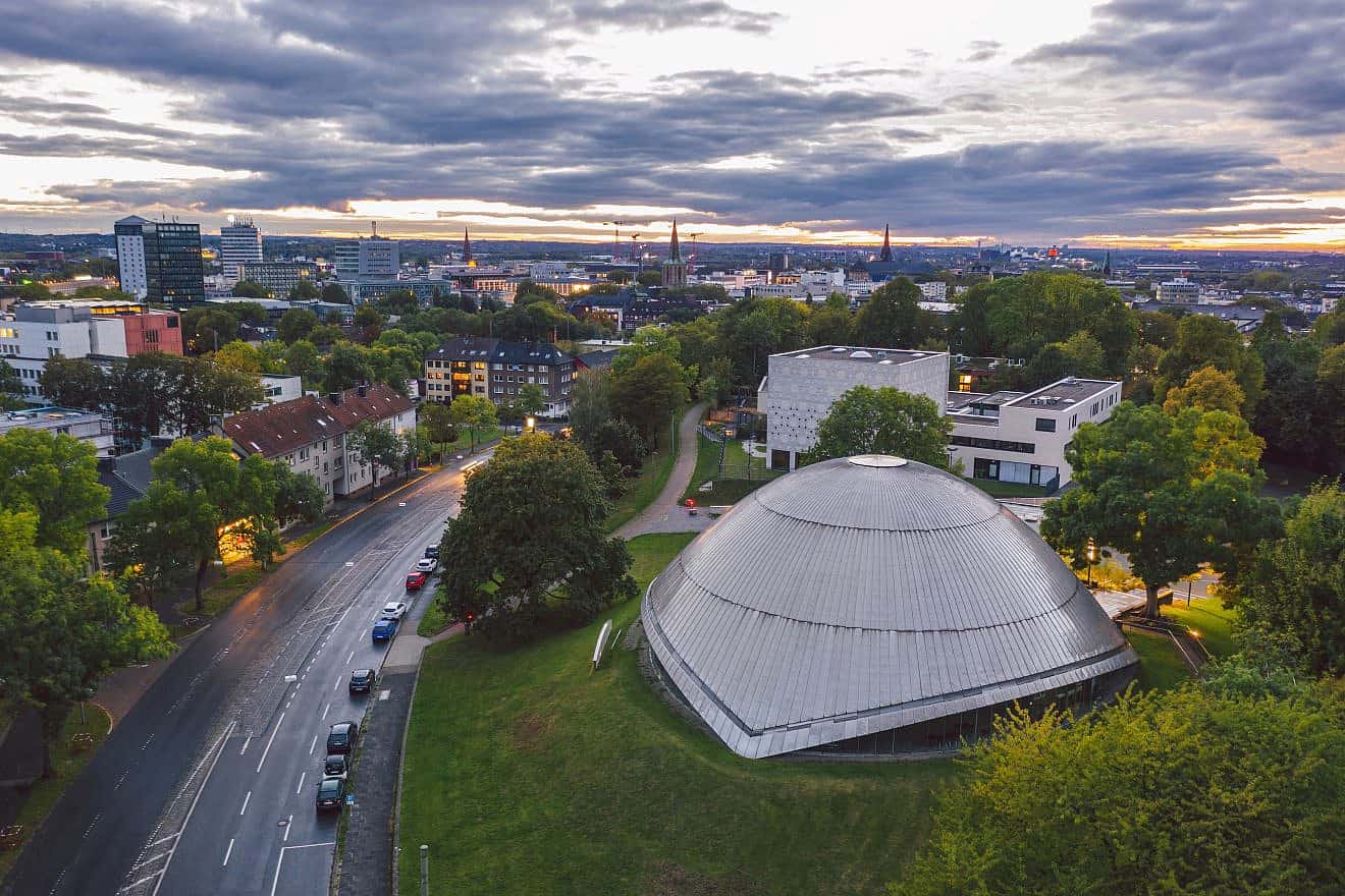 The Zeiss Planetarium (bottom right) in Bochum, Germany, with the New Synagogue behind it. Credit: uslatar/Shutterstock.