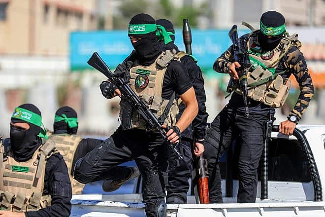 Hamas terrorists celebrating the anniversary of kidnapping the body of Israeli soldier Shaul Aron in 2014, July 20, 2022. Photo by Anas-Mohammed/Shutterstock.