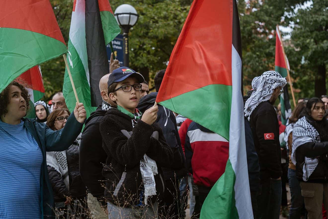 Protesters with Palestinian flags on the University of Michigan campus in Ann Arbor on Oct. 15, 2023. Credit: Catherine D. Miller/Shutterstock.