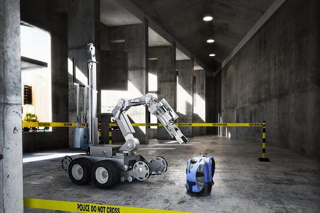 Police controlled bomb squad robot inspecting a suspicious backpack. Credit: Digital Storm/Shutterstock.
