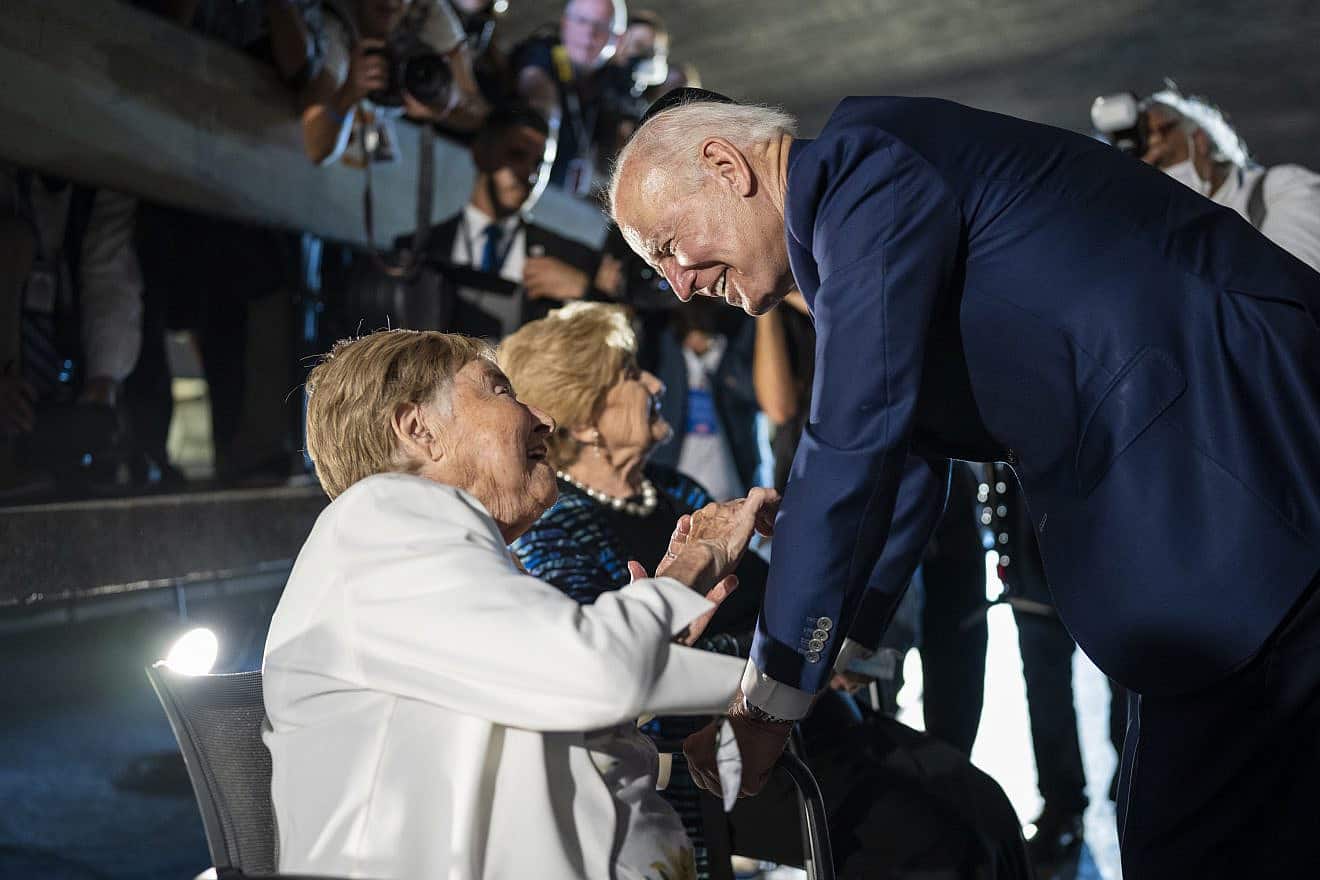 U.S. President Joe Biden speaks with Holocaust survivors Gita Cycowicz and Rena Quint after a wreath-laying ceremony on July 13, 2022 at Yad Vashem in Jerusalem. Credit: Adam Schultz/White House.