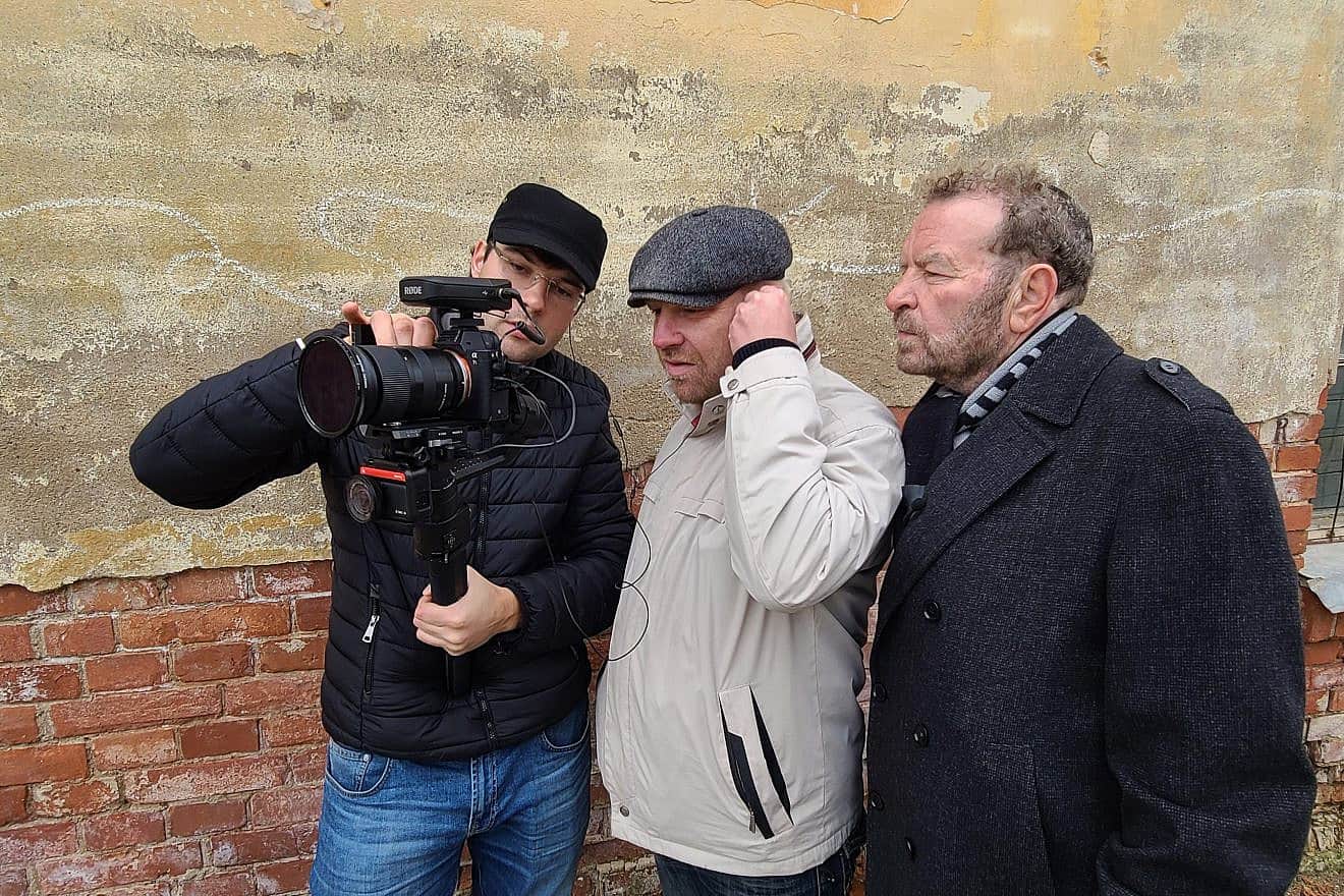 Narrator Dudu Fisher in what was the Riga Ghetto, during the filming of the documentary “Baltic Truth.” Photo by Eugene Levin.