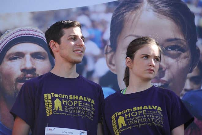 Gilad Shalit and his then-girlfriend attend the Fourth international Jerusalem Marathon on March 21, 2014. Photo by Mendy Hechtman/Flash90.