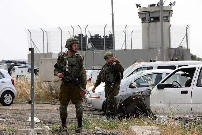 Israeli soldiers at the scene of a car ramming attack in the Hebron Hills, May 14, 2020. Photo by Wisam Hashlamoun/Flash90.