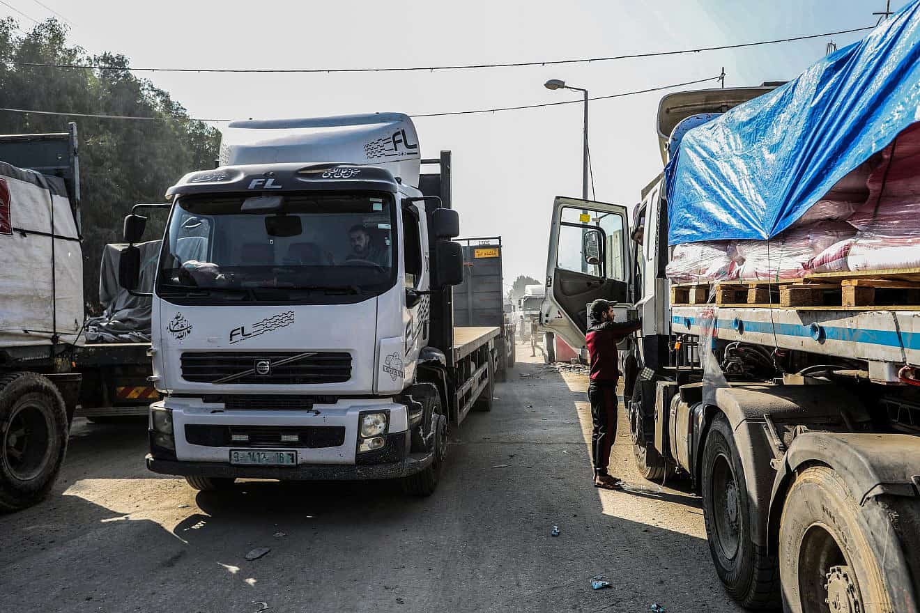 Trucks with humanitarian aid arrive at the Palestinian side of the Kerem Shalom border crossing in the southern Gaza Strip on Dec. 18, 2023. Photo by Abed Rahim Khatib/Flash90.