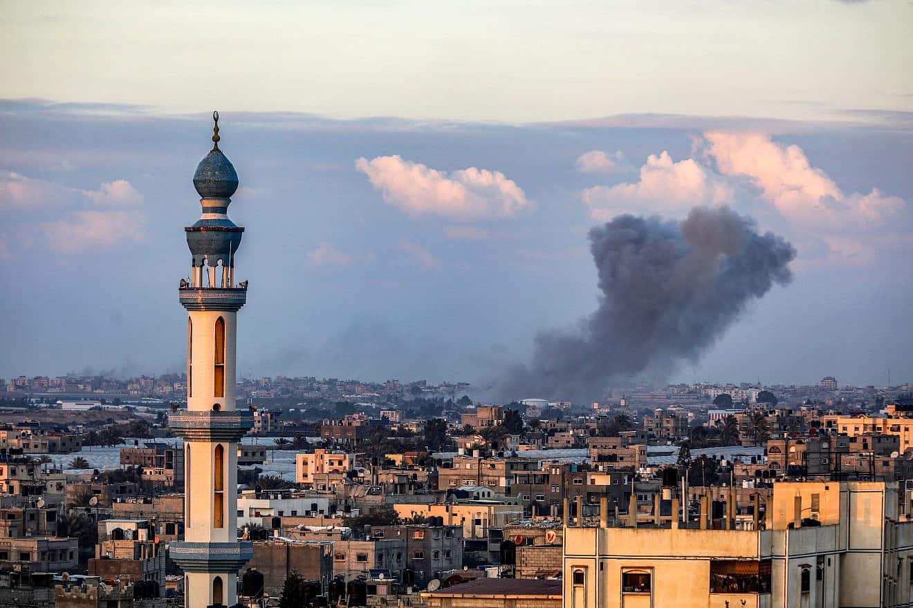 Smoke rises after Israeli air strikes in Khan Yunis as it seen from Rafah, in the southern Gaza Strip, on Jan. 24, 2024. Photo by Abed Rahim Khatib/Flash90.