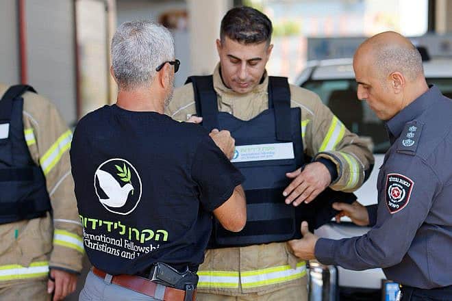 The International Fellowship of Christians and Jews provides ballistic and protective flak jackets to Israeli firefighters. Photo by Guy Yechieli.