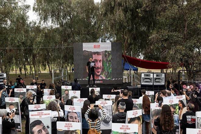 Michael Levy, whose brother Or Levy is being held by Hamas in Gaza, speaks at a memorial ceremony at the site of the Supernova music festival near Kibbutz Re'im on Jan. 5, 2024. Credit: Courtesy of the Hostages and Missing Families Forum HQ.