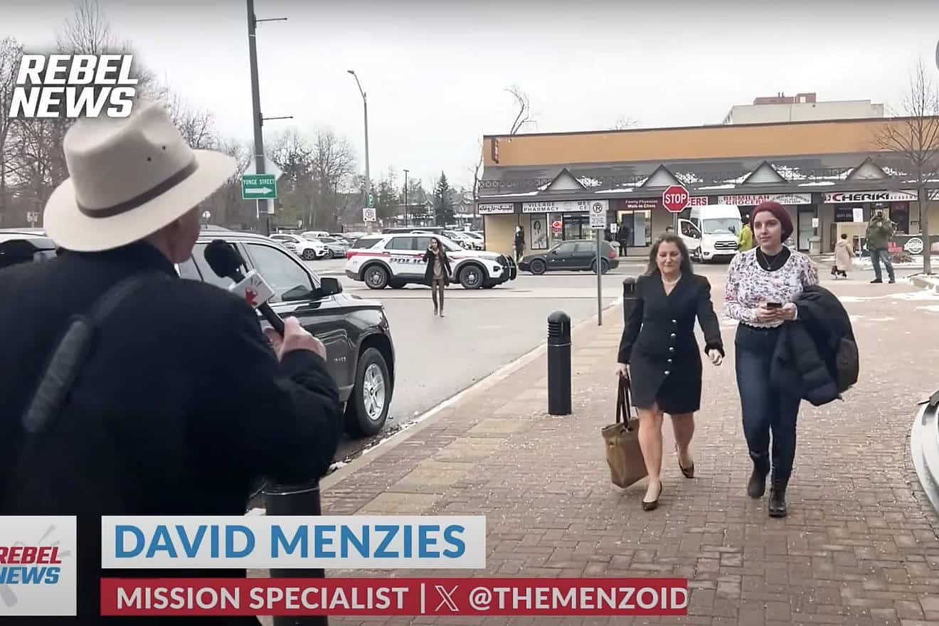 David Menzies, of “Rebel News,” approaches Chrystia Freeland, the Canadian minister of finance, attempting to interview her. Source: YouTube/“Rebel News.”