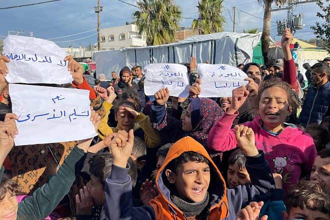 Several dozen Palestinians demonstrate in Deir al-Balah, the central Gaza, calling on Hamas to free all Israeli captives and end the war so they can return to their homes, Jan. 24, 2024. Photo by Majdi Fathi/TPS.
