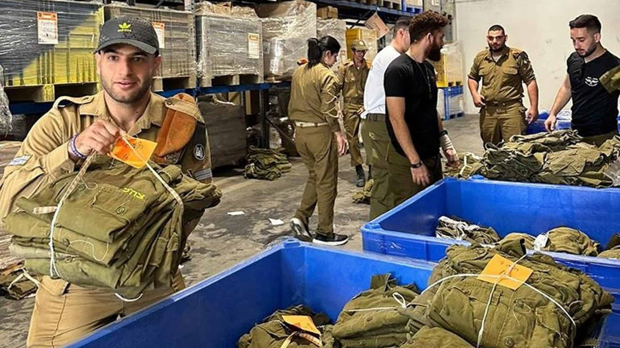 IDF soldiers with special needs pack equipment at a logistics center in Ramla. Credit: Special in Uniform.