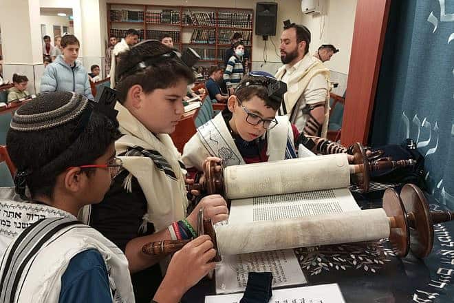 Amichai Jackson is called up to the Torah on his bar mitzvah, January 2024. Credit: Courtesy.