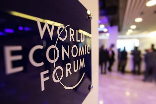 Emblem of the World Economic Forum in Davos, Switzerland. Credit: Drop of Light/Shutterstock.