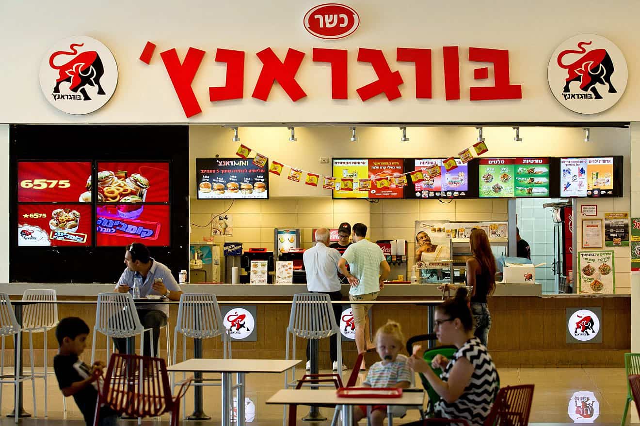 Customers at the Burger Ranch fast-food chain in Israel. Photo by Moshe Shai/Flash90.