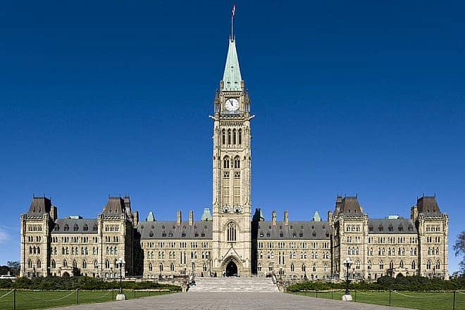 The Centre Block Canadian Parliament building with the Peace Tower in front, in Ottawa, Southern Ontario. Credit: Saffron Blaze via Wikimedia Commons.