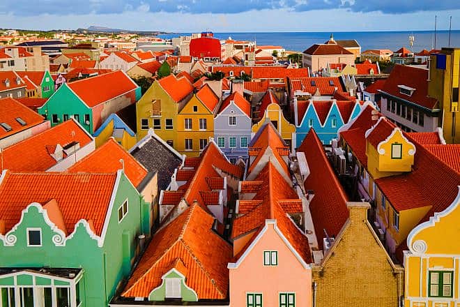 The colorful homes and buildings in Willemstad, the capital of Curaçao, in the Dutch Antilles. Credit: Fokke Baarssen/Shutterstock.