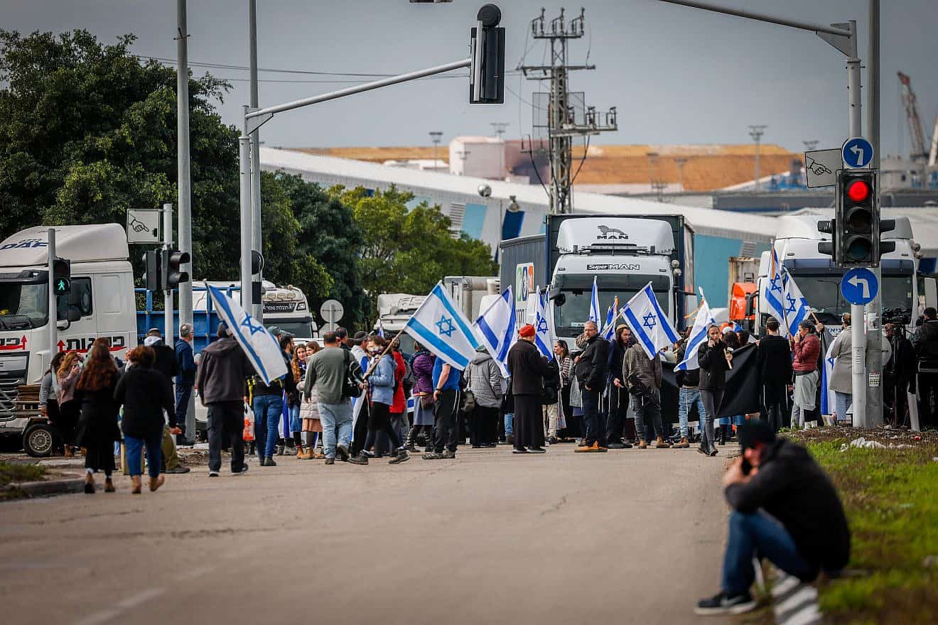People block the entrance to Ashdod Port during a protest against aid entering the Gaza Strip, Feb. 1, 2024. Photo by Chaim Goldberg/Flash90.
