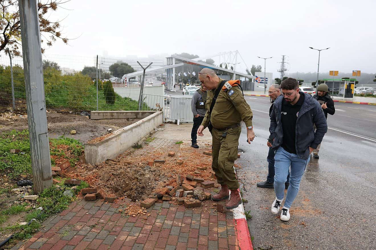 Israeli security personnel at the scene where a rocket fired from Lebanon hit Safed, Feb. 14, 2024. Photo by David Cohen/Flash90.