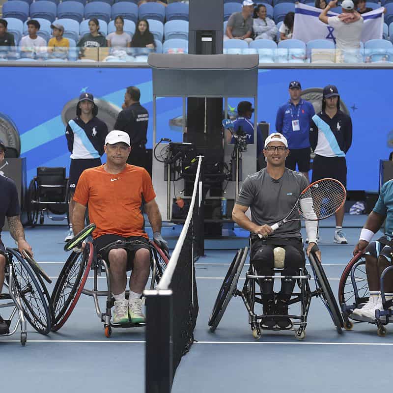 From left: Andy Lapthorne (GBR) and David Wagner (USA) with Guy Sasson (ISR) and Donald Ramphadi (RSA) during the coin toss of the Men's Wheelchair Doubles final at the Australian Open in Melbourne, Jan. 26, 2024. Photo by David Mariuz/Tennis Australia.
