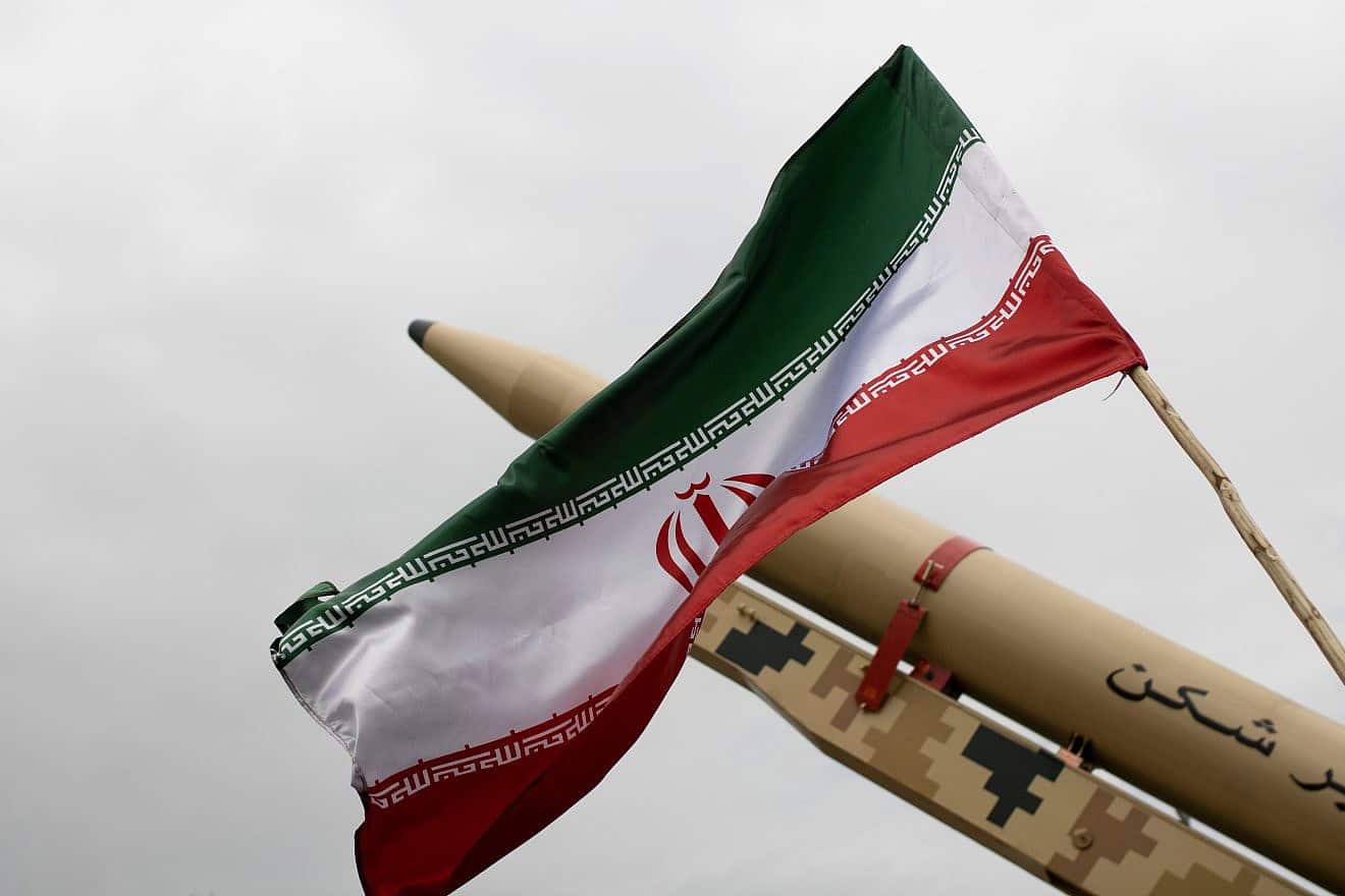An Iranian flag over a missile, April 2022. Credit: Mohasseyn/Shutterstock,