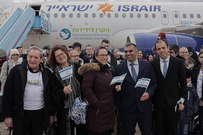 Israeli Minister of Aliyah and Integration Ofir Sofer (second from right) with new Israelis at Ben-Gurion International Airport. Credit: Courtesy.
