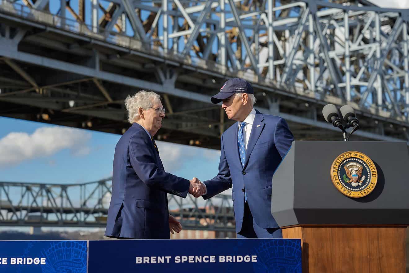 Sen. Mitch McConnell (R-Ky.) and U.S. President Joe Biden at the Brent Spence Bridge, a double-decker cantilevered truss bridge that carries Interstates 71 and 75 across the Ohio River between Covington, Ky., and Cincinnati, which will see an improvement project as a result of the bipartisan infrastructure bill, Jan. 4, 2023. Credit: Official White House Photo via Wikimedia Commons.