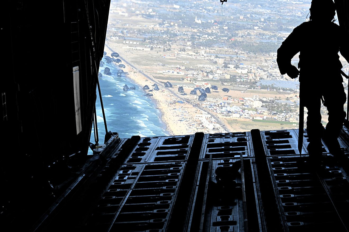 A U.S. Air Force loadmaster releases humanitarian aid pallets of food and water over the Gaza Strip on March 2, 2024. Credit: U.S. Air Force.