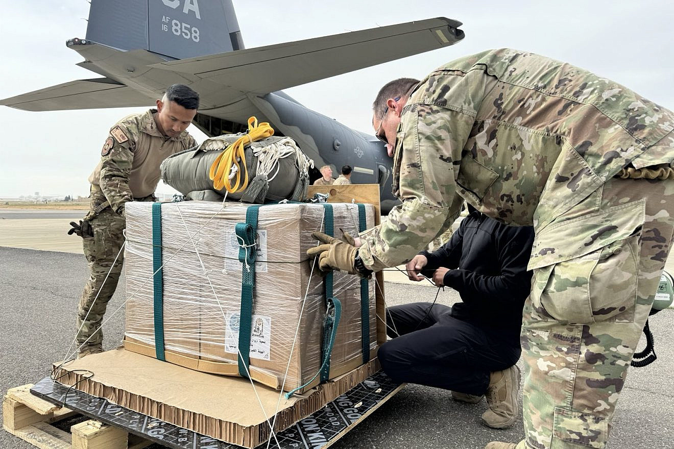 U.S. Air Force loadmasters arrange bundles of humanitarian aid destined for an airdrop over the Gaza Strip onto a HC-130J Combat King II at an undisclosed location within the U.S. Central Command area of responsibility on March 20, 2024. Credit: U.S. Air Force Photo.