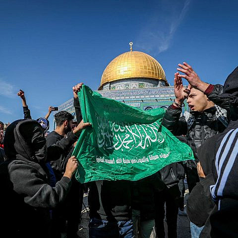 Palestinians wave a Hamas banner on the Temple Mount in Jerusalem, Jan. 27, 2023. Photo by Jamal Awad/Flash90.