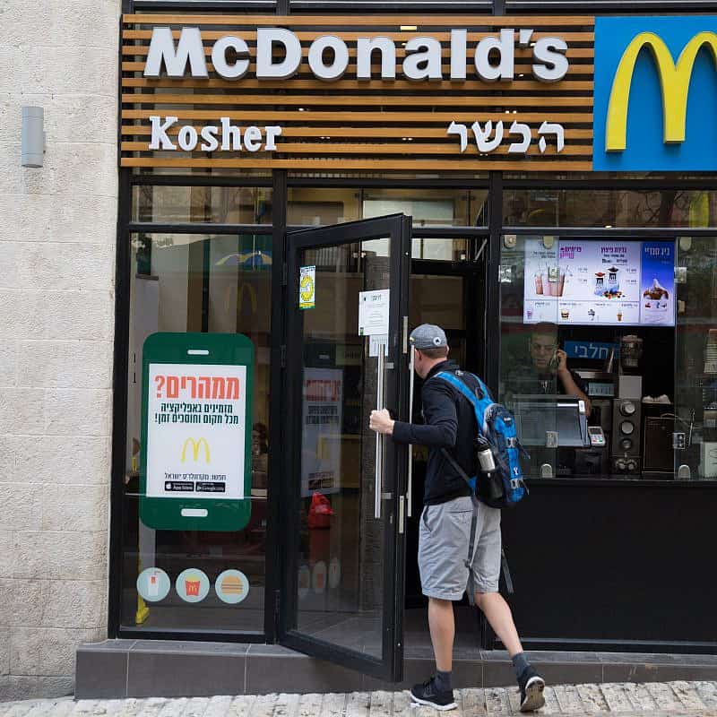 A man walks into a McDonald's restaurant in central Jerusalem on April 13, 2016. Photo by Nati Shohat/Flash90.