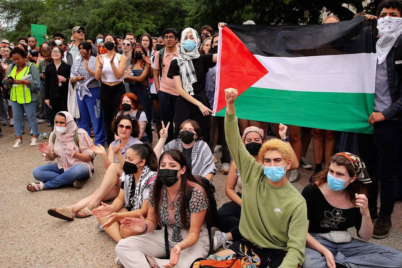 Students at the University of Texas students, many of them masked, rally for Hamas and Palestinians in the Gaza Strip in the wake of the Oct. 7 terrorist attacks, and against Israel, April 25, 2024. Credit: Vic Hinterlang/Shutterstock.